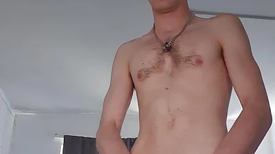close up of skinny lad playing with floppy cock